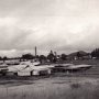 Possibly c 1960's?  Similar view to c1935-36 photo.  Large pipes on right used for blowing sawdust from the mill to the sawdust heap.